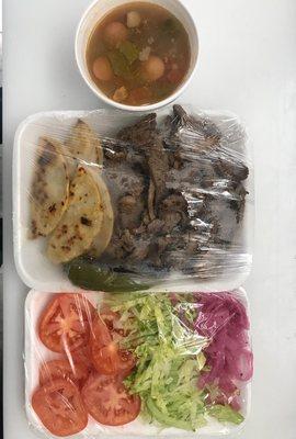 A plate of carne asada and frijoles charros