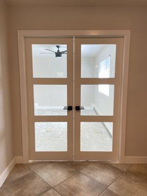 Sergio installed the handle holes and striker holes on our French doors