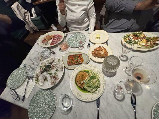 Appetizers: oysters, Jabon Iberico, Panceta de Cerdo, Champinones Rellenos con Chorizo, bread and Brasa Wedge