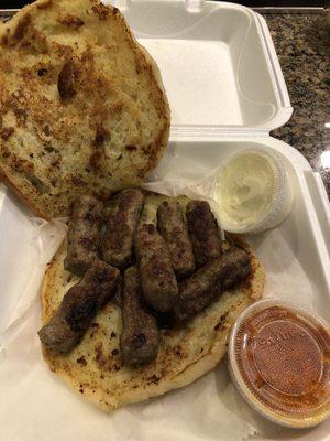 8 piece Cevapi with Lepinja, ajvar and Kajmak. Also comes with white chopped onions.