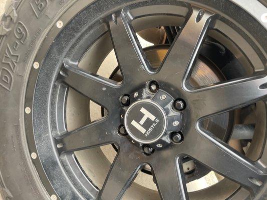 Scratched rim and broken lug nut