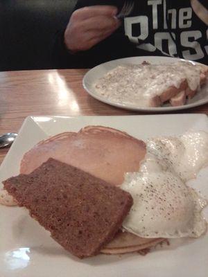 Short stack with eggs over easy and scrapple everything cooked perfectly.