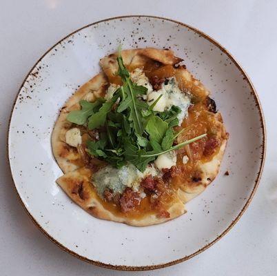 Schokko Café Peachy Pig Flatbread $12 Spiced peach jam, caramelized onions, pancetta and smoked blue cheese