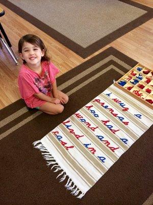 Children practice "writing" with the moveable alphabet to express their thoughts. (Unconventional spelling is common at this stage.)