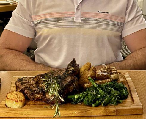 Porterhouse steak with scallop, potatoes, roasted garlic