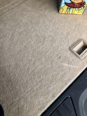 This is a photo of a backseat that should have been vacuumed. (Which I paid for)