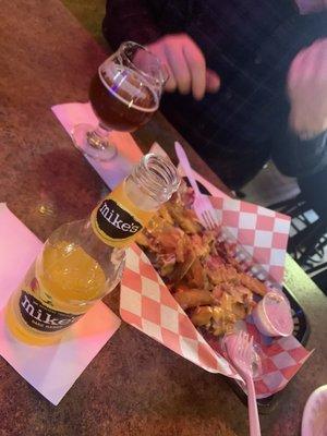 Snacks and drinks. Great tasting perfectly cut fries. These are the cheddar bacon. Sweetheart waitress Lenea. Will stop again!