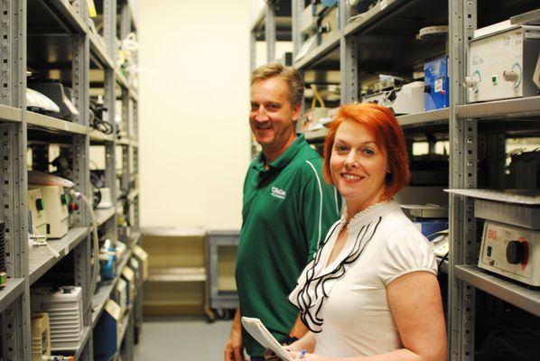 Owner Doug Bane, and marketing coordinator Wendi in the BaneBio warehouse.