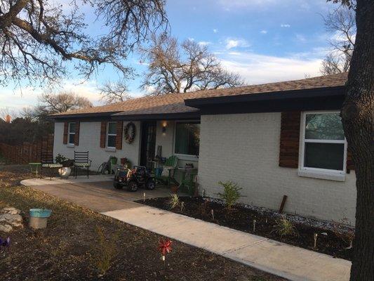I used a color on the trim called dark room and on the brick called aged white. Shutters made by my husband at sink or swim designs