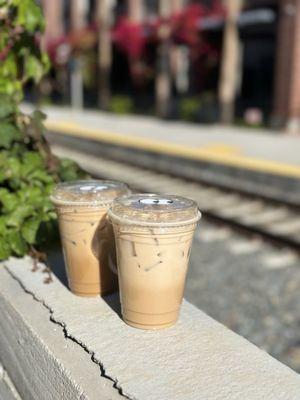 2 Iced Vanilla Latte's from Nosy Neighbors Coffee & Donuts located inside Redlands Public Market (04/20/25).
