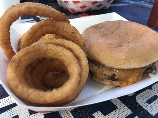 Camel burger with cheese and onion rings