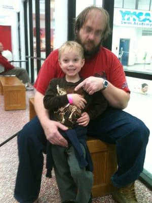 Kaspian showing off his new deep water swim band. He got to ride the water slide!