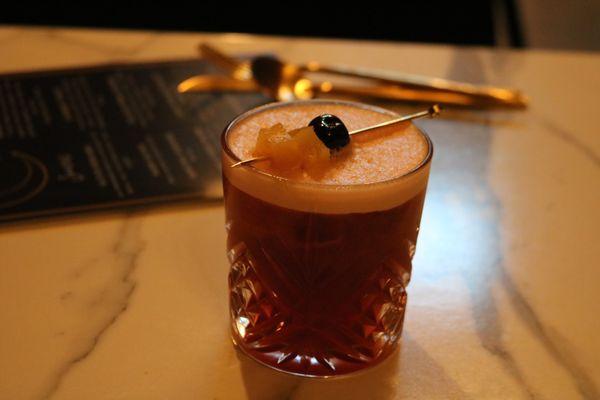 Our tiki vacation in a glass. The Hook, dark rum, Campari, pineapple juice, and lime.