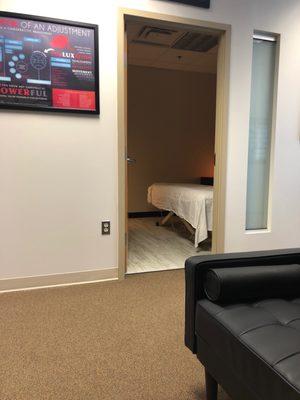 Waiting area and room for massage behind the door.