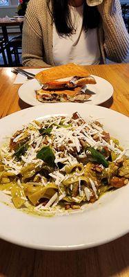 Homemade Fettucine, grilled chicken with pesto, blistered tomatoes, toasted pine nuts, and ricotta grated on top! Amazing!