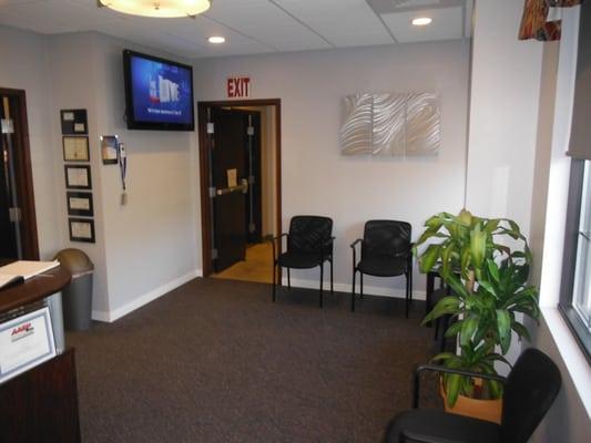 Clean and comfortable waiting room area. With a view showing the HDTV.