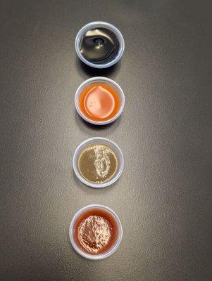 Sauces laid out from mildest (top) to spiciest (bottom)