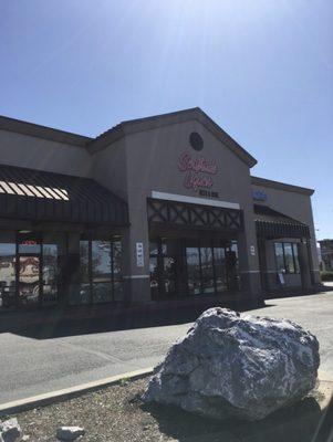 Front of business including sign