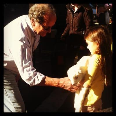 Julian of Soledad goats showing how to properly hold a Kid (baby goat)