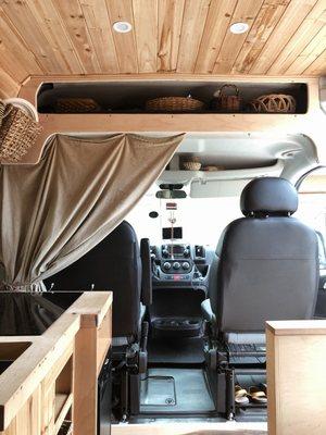 View from the back of the van...upper storage, privacy curtain.