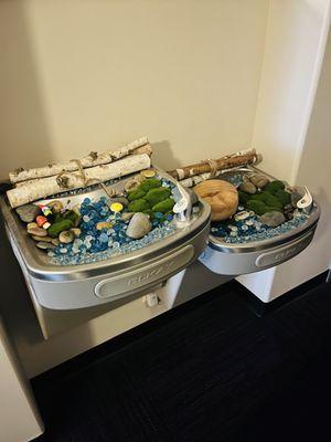 Interesting way to decorate a non functioning water fountain! And yes they have water elsewhere that they offer you...