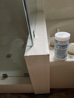 Caulking has already come up and water is escaping underneath.