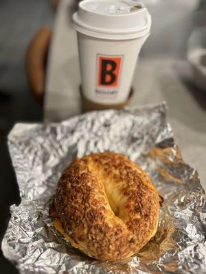 Bacon egg and cheese on Asiago bragel