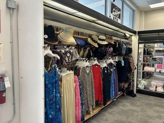 More hats and a whole selection of clothes. This is not a beach location so I don't quite get this.