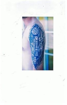 custom mechanical arm tattoo