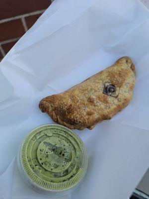 Chicken empanada with garlic cilantro sauce