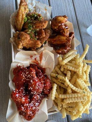 From top left in clockwise order: Saigon Street wings, BBQ Chipotle wings, Garlic Fries, Peking wings