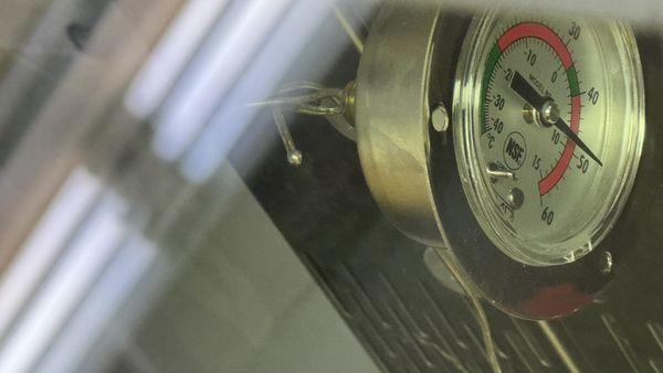 The thermometer, was almost all the way hidden from view.