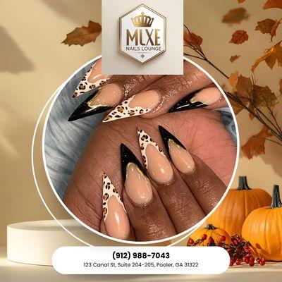 Bright & Beautiful Nails French tips with a touch of cheetah. Schedule today!