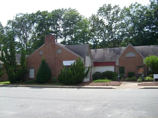 Outside of business, next to Riverside Health...