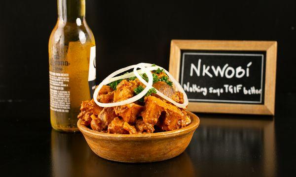Nkwobi - Cut-up beef legs cooked in creamy sauce bursting with local flavors. A highly sought-after street food favorite!