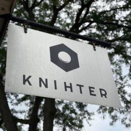 You'll see the Knihter sign hanging from the corner of the building