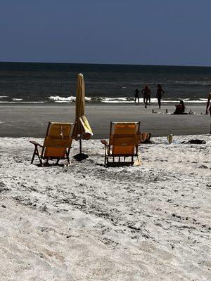 Beach chairs and umbrella setup