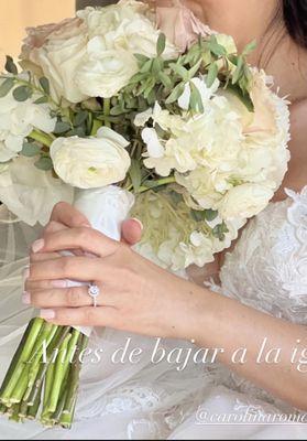 Bridal bouquet has nice shape but drooping flowers