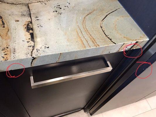 Chipped granite from repairman leaning it agains counter