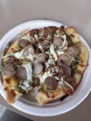 Pesto, sausage, caramelized onions. Crumbled sausage would be better than mass of sliced link