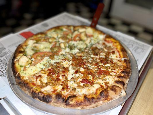 1/2 Fra Diavolo Pizza 1/2 Chicken Pesto W fried chicken on red pepper dough. The pesto is very good.