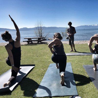 Twisting on Lake Tahoe. Yoga outdoors in the sun is a great way to start your day.