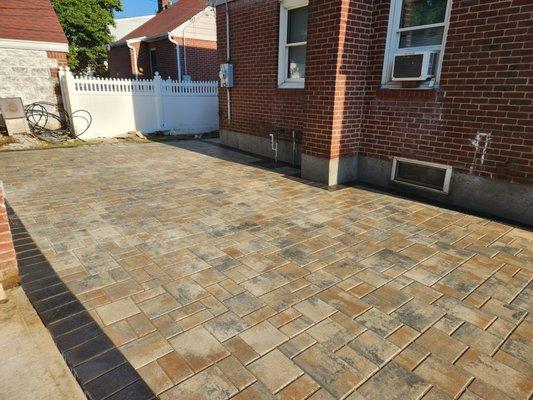 brown paving stone yard with play area