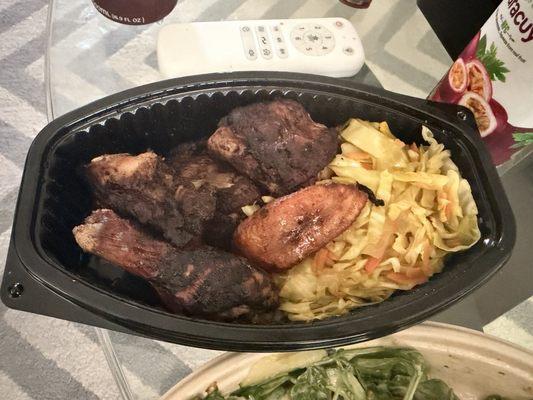Jerk chicken with 2 sides cabbage and plantains