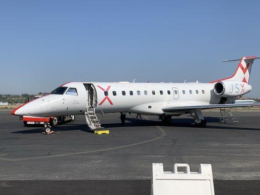 JSX's 30-seat Embraer 135 jet on the tarmac in Concord.