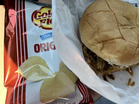 Pulled pork sandwich and chips