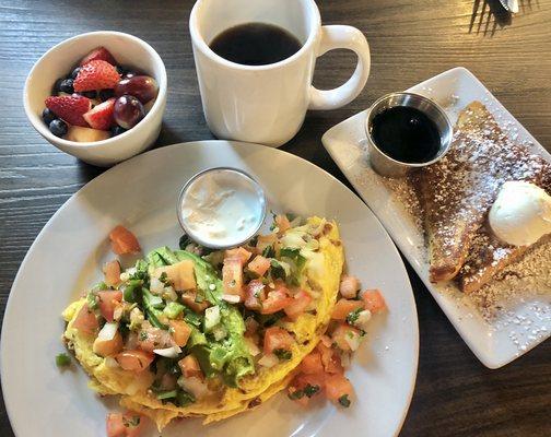 Cali style omelette topped with fresh pico de Gallo and add sour cream. With fruit and one piece of French toast.