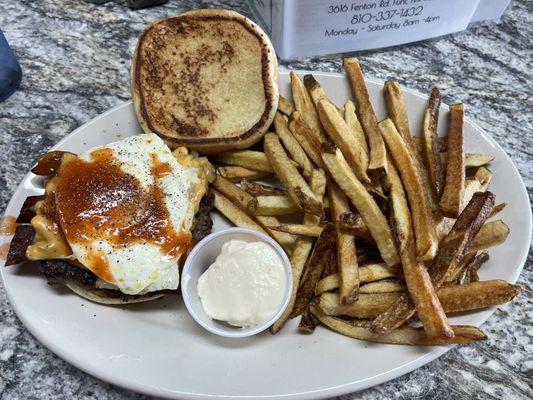 Egg burger with cheese and bacon.