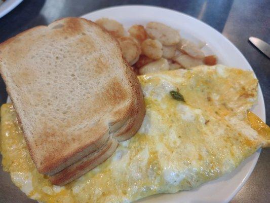 Three egg everything omelette with American fries and sourdough toast