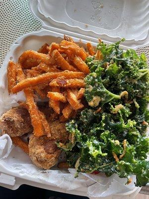 Entree and two sides - "chicken drummies", garlic kale salad, and sweet potato fries